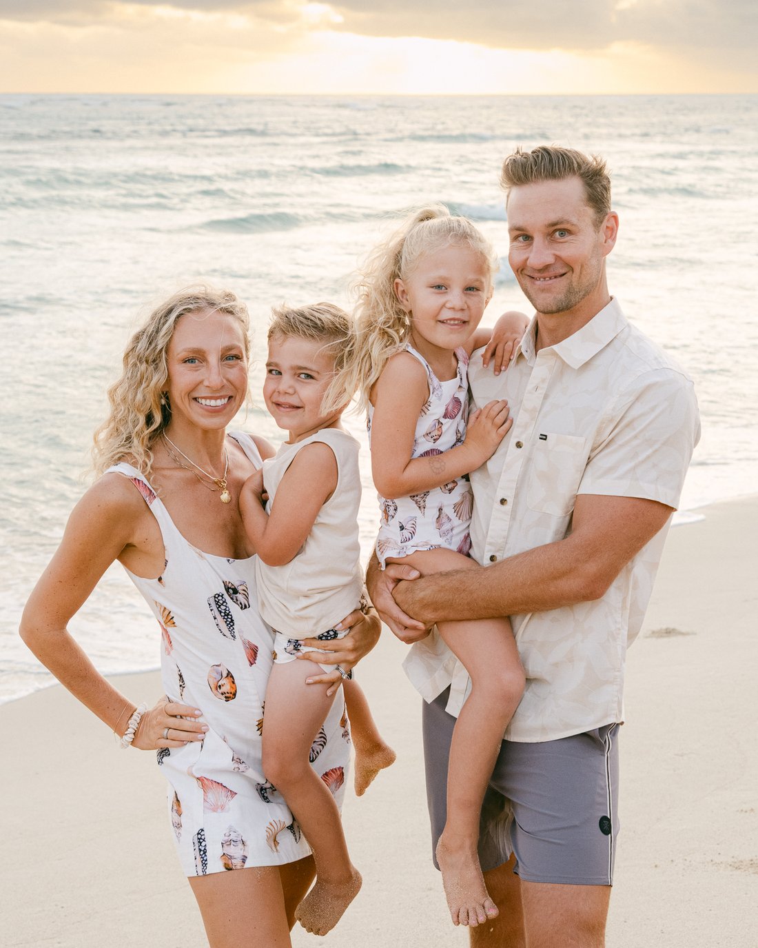Mike Griffith, founder of Carlsbad Athletic Club, with his family on the beach at sunset