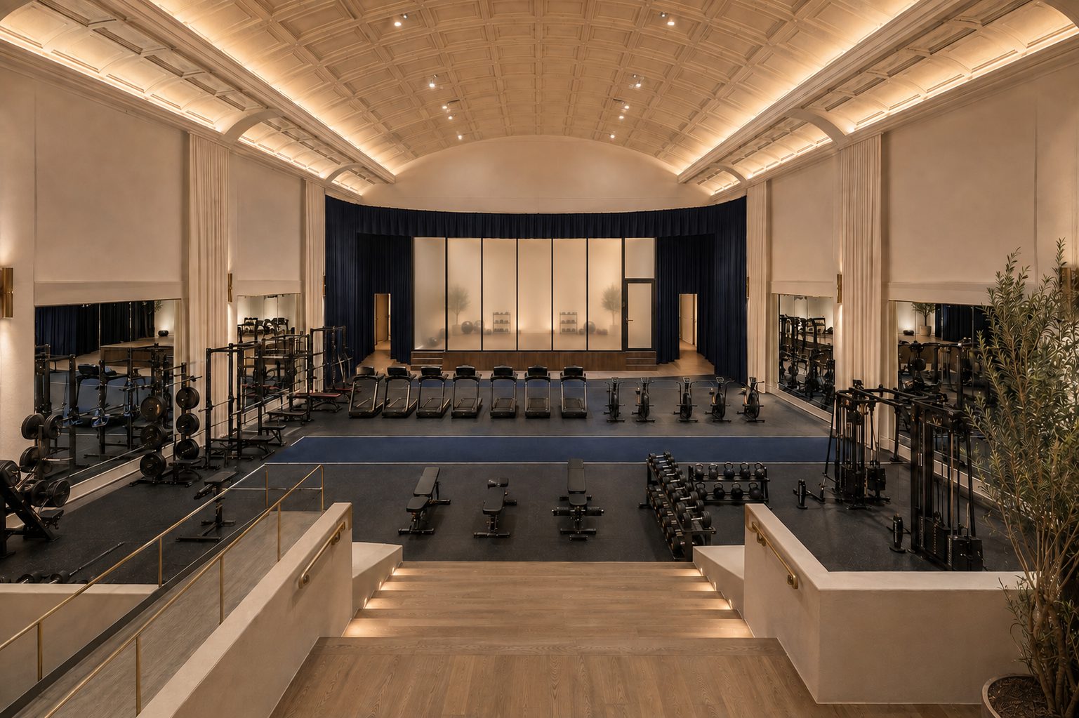The Carlsbad Athletic Club training floor inside the restored theater auditorium, with the domed ceiling and sunken floor